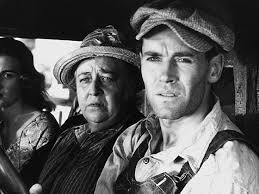 Scene evoking Steinbeck's The Grapes of Wrath, a story of structural change — mechanisation, migration, and the collapse of old ways of life — rather than a single event