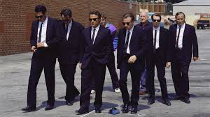 The stand-off from Reservoir Dogs, used as a metaphor for software projects where every stakeholder sees a different system and communication breaks down