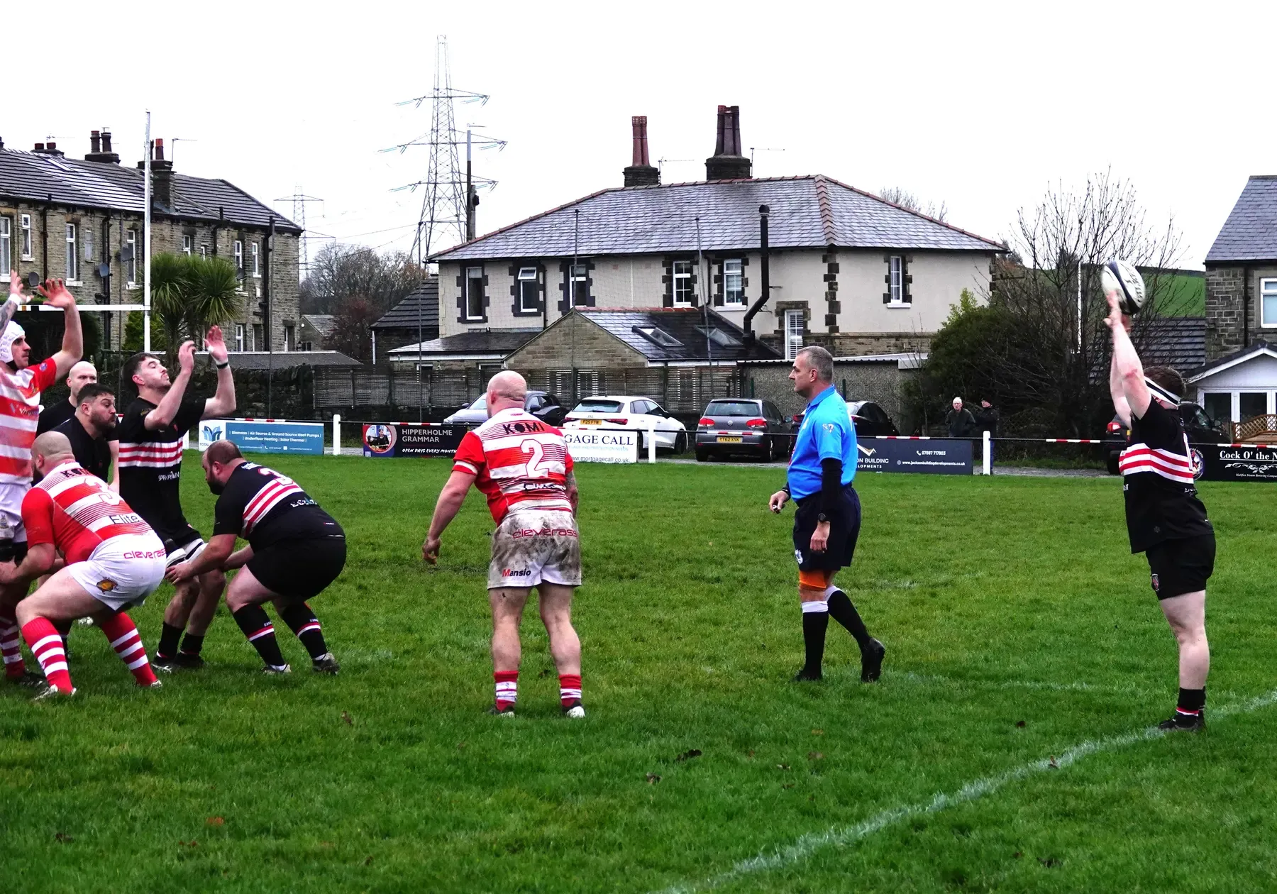 Players contest possession during a rugby match at Old Brodleians.